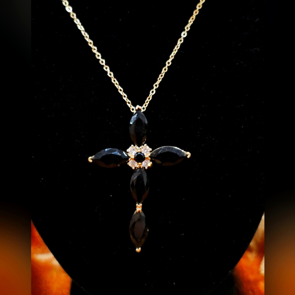 This delicate, handcrafted Moldavite cross pendant is one of a kind.